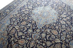 Backside of handmade 2000s Kashmar rug showing knot structure and weave density