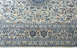 Corner detail of 2000s Kashmar rug showing border pattern and Wool pile