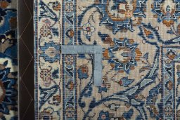 Backside of handmade 2000s Kashmar rug showing knot structure and weave density