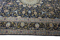 Corner detail of 2000s Kashmar rug showing border pattern and Wool pile