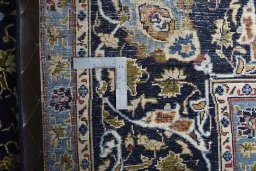Backside of handmade 2000s Kashmar rug showing knot structure and weave density