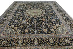 Surface texture of 2000s Kashmar rug with natural Wool and intricate pattern