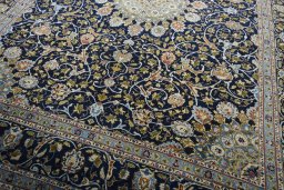 Close-up detail of 2000s Kashmar rug from Iran / Persia showing Wool weave