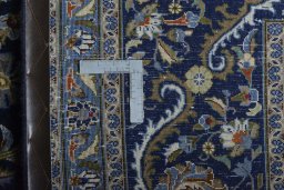 Backside of handmade 2000s Kashmar rug showing knot structure and weave density