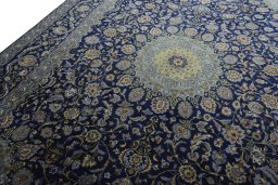 Backside of handmade 2000s Kashmar rug showing knot structure and weave density