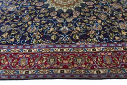 Corner detail of 2000s Kashmar rug showing border pattern and Wool pile