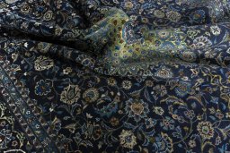 Surface texture of 2000s Kashmar rug with natural Wool and intricate pattern