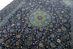 Backside of handmade 2000s Kashmar rug showing knot structure and weave density