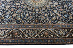Corner detail of 2000s Kashmar rug showing border pattern and Wool pile