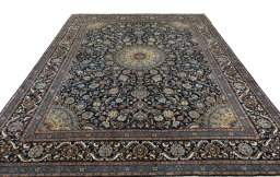 Surface texture of 2000s Kashmar rug with natural Wool and intricate pattern