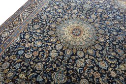 Backside of handmade 2000s Kashmar rug showing knot structure and weave density
