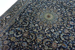 Backside of handmade 2000s Kashmar rug showing knot structure and weave density