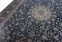 Backside of handmade 2000s Kashmar rug showing knot structure and weave density
