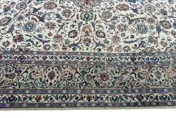 Corner detail of 2000s Kashmar rug showing border pattern and Wool pile