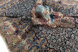 Surface texture of 1970s Kashmar rug with natural Wool and intricate pattern