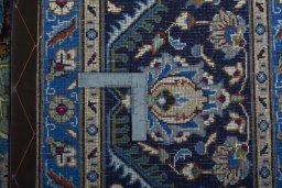 Backside of handmade 2000s Kashmar rug showing knot structure and weave density