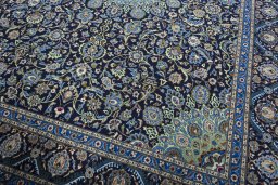 Close-up detail of 2000s Kashmar rug from Iran / Persia showing Wool weave