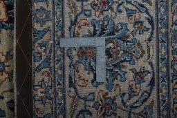 Backside of handmade 2000s Kashmar rug showing knot structure and weave density