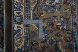 Backside of handmade 2000s Kashmar rug showing knot structure and weave density