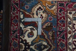 Backside of handmade 2000s Kashmar rug showing knot structure and weave density