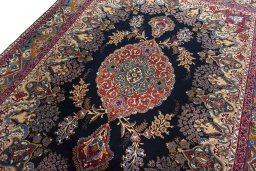 Backside of handmade 2000s Kashmar rug showing knot structure and weave density