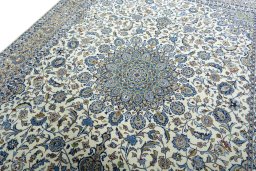 Backside of handmade 2000s Kashmar rug showing knot structure and weave density