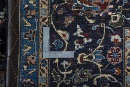 Backside of handmade New Kashmar rug showing knot structure and weave density
