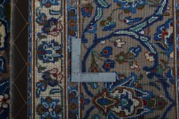 Backside of handmade 2000s Kashmar rug showing knot structure and weave density
