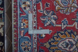 Backside of handmade 2000s Kashmar rug showing knot structure and weave density