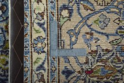 Backside of handmade 2000s Kashmar rug showing knot structure and weave density