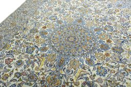 Backside of handmade 2000s Kashmar rug showing knot structure and weave density