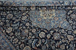 Close-up detail of 2000s Kashmar rug from Iran / Persia showing Wool weave