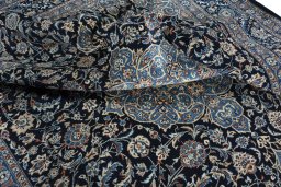 Surface texture of 2000s Kashmar rug with natural Wool and intricate pattern