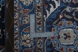Backside of handmade 2000s Kashmar rug showing knot structure and weave density