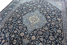 Backside of handmade 2000s Kashmar rug showing knot structure and weave density