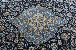 Central medallion detail of 2000s Kashmar rug from Iran / Persia