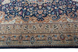 Corner detail of 1970s Kashmar rug showing border pattern and Wool pile