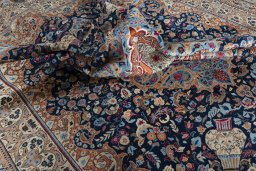 Surface texture of 1970s Kashmar rug with natural Wool and intricate pattern