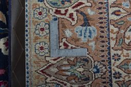 Backside of handmade 1970s Kashmar rug showing knot structure and weave density