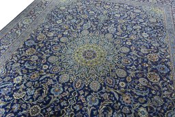 Backside of handmade 2000s Kashmar rug showing knot structure and weave density
