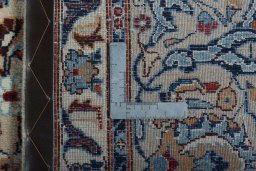 Backside of handmade 2000s Kashmar rug showing knot structure and weave density
