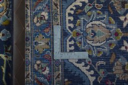 Backside of handmade 2000s Kashmar rug showing knot structure and weave density
