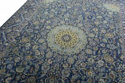 Backside of handmade 2000s Kashmar rug showing knot structure and weave density