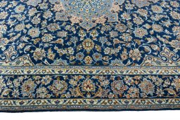 Corner detail of 2000s Kashmar rug showing border pattern and Wool pile