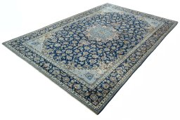 Corner detail of 2000s Kashmar rug showing border pattern and Wool pile