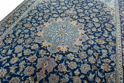 Backside of handmade 2000s Kashmar rug showing knot structure and weave density