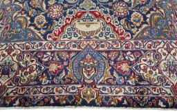 Corner detail of 2000s Kashmar rug showing border pattern and Wool pile