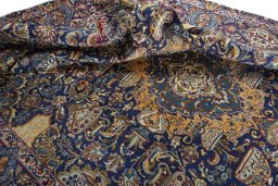 Backside of handmade 2000s Kashmar rug showing knot structure and weave density