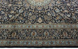 Corner detail of 2000s Kashmar rug showing border pattern and Wool pile