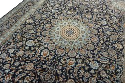Backside of handmade 2000s Kashmar rug showing knot structure and weave density